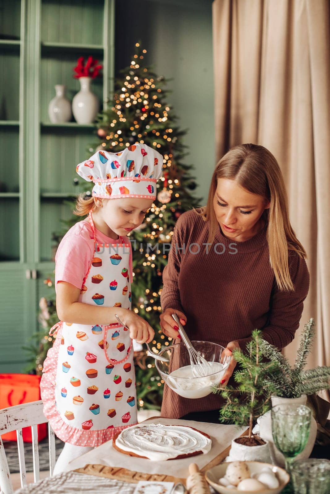 kitchen with a Christmas tree is preparing or cooking ginger cookies for Christmas or New year