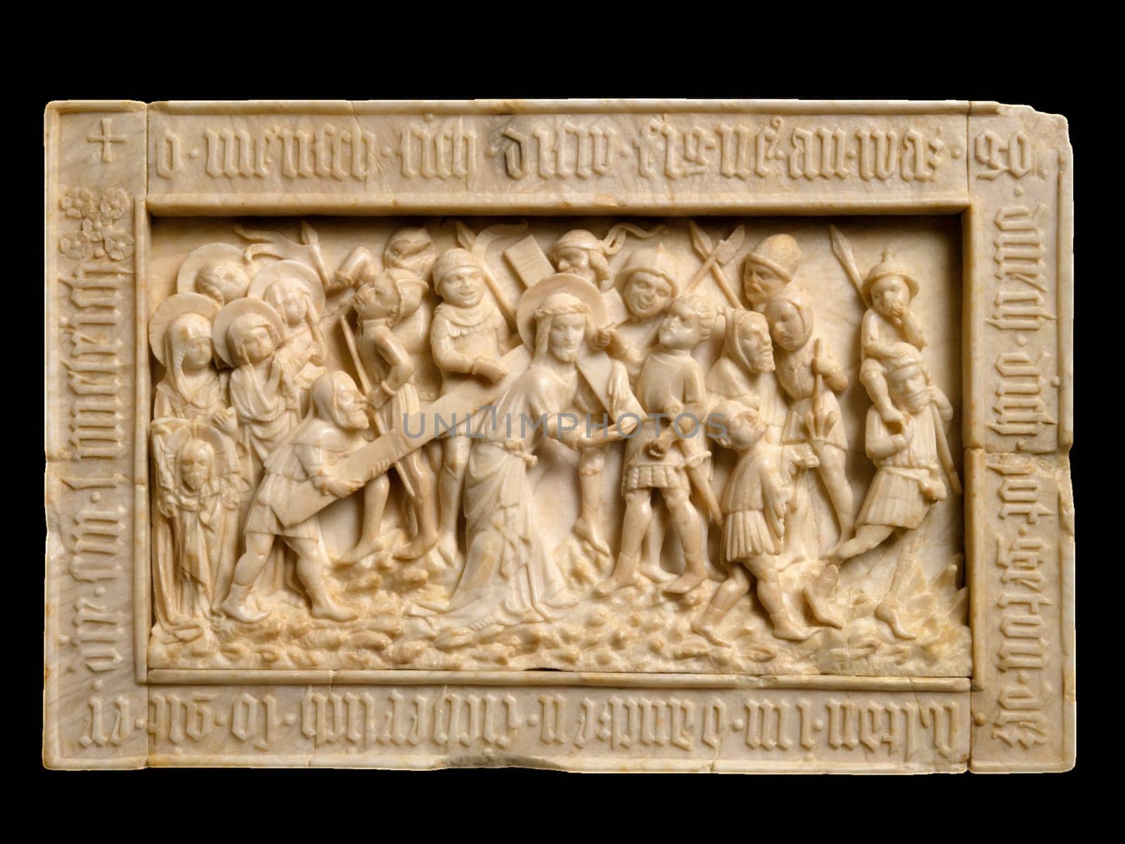 Ivory relief sculpture of The Road to Calvary, attributed to the Master of the Lorsch Calvary, depicting Christ carrying the cross with Mary and a procession of figures.