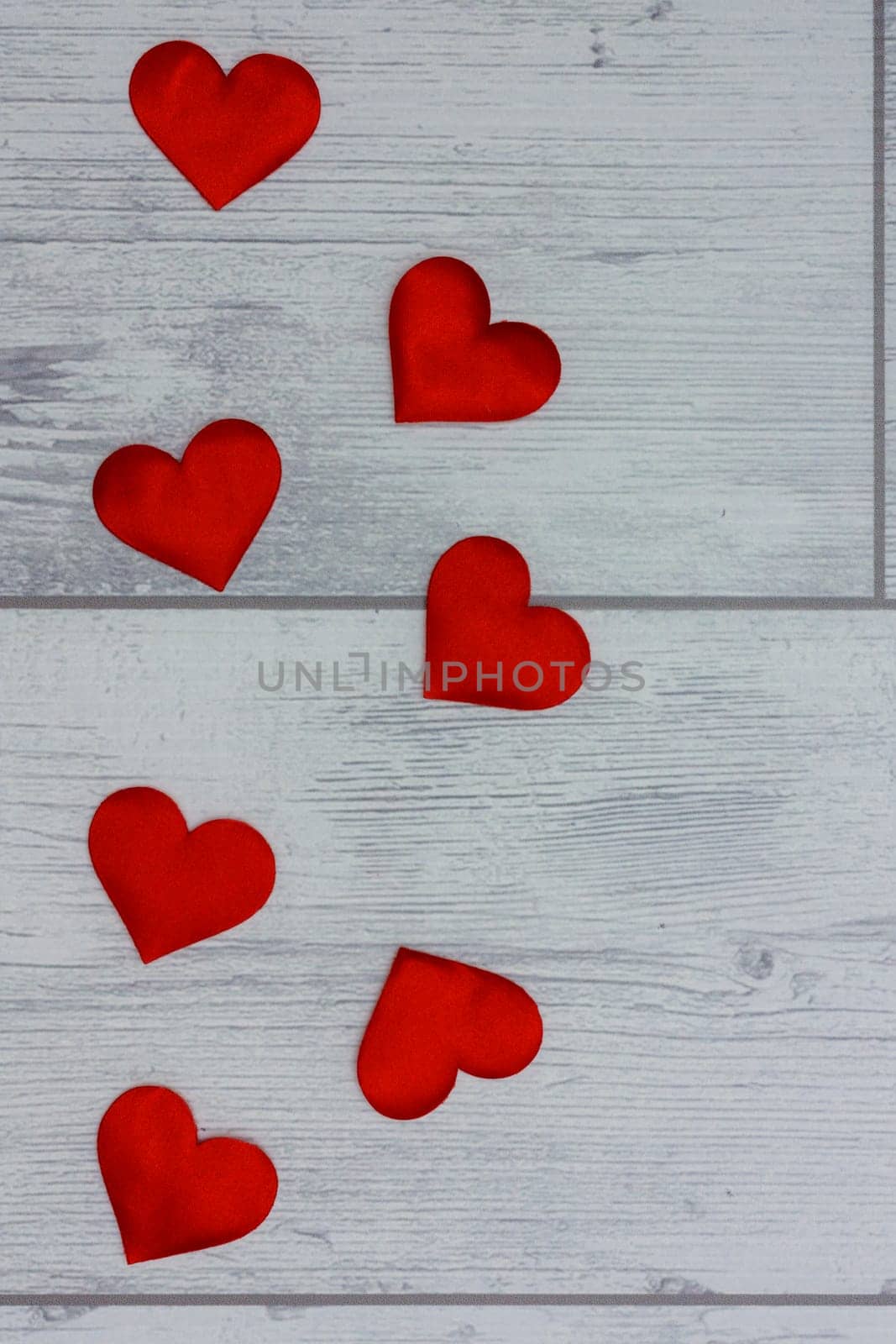 Red heart on a wooden table texture background. by mailos