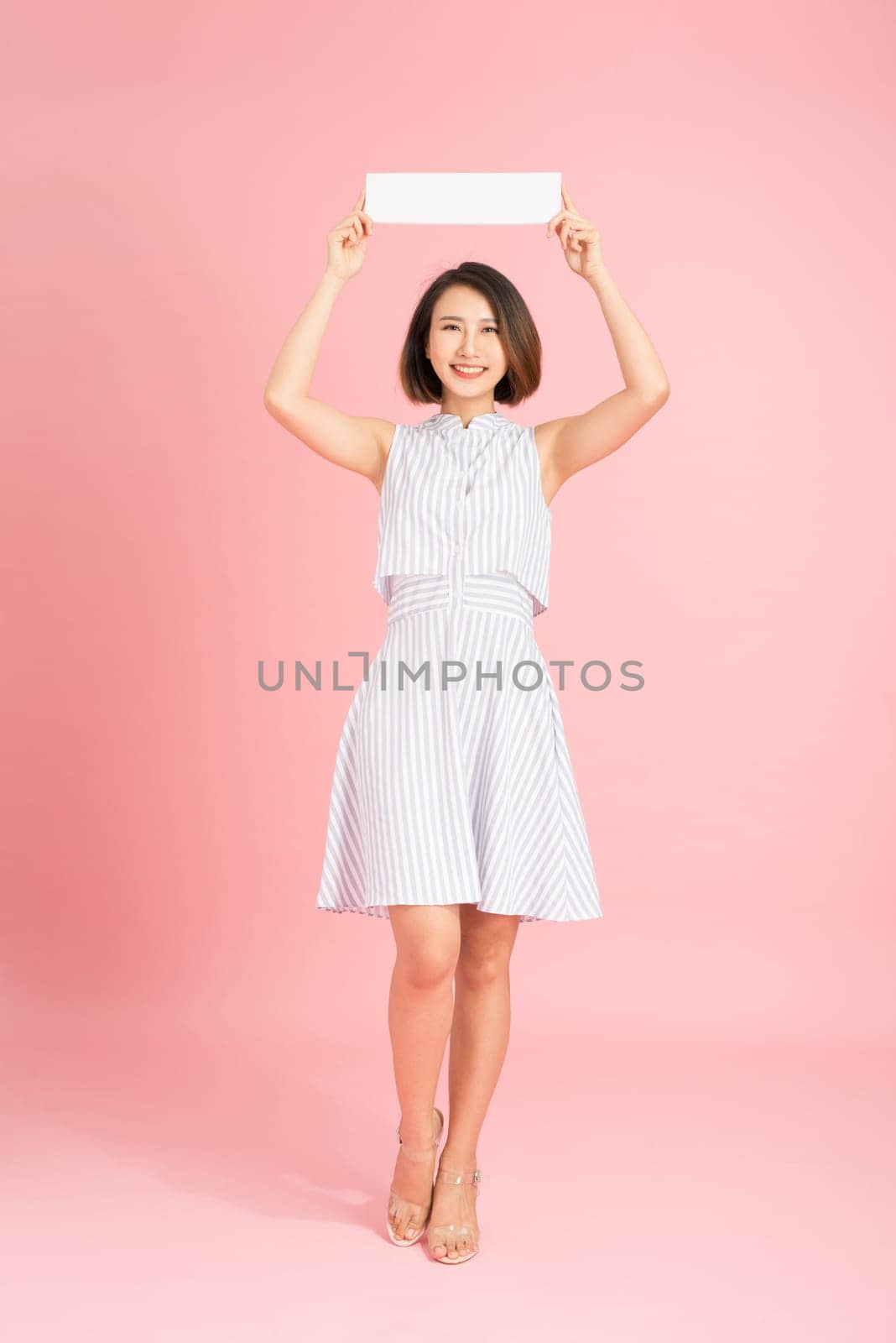 woman hold white banner . isolated portrait .