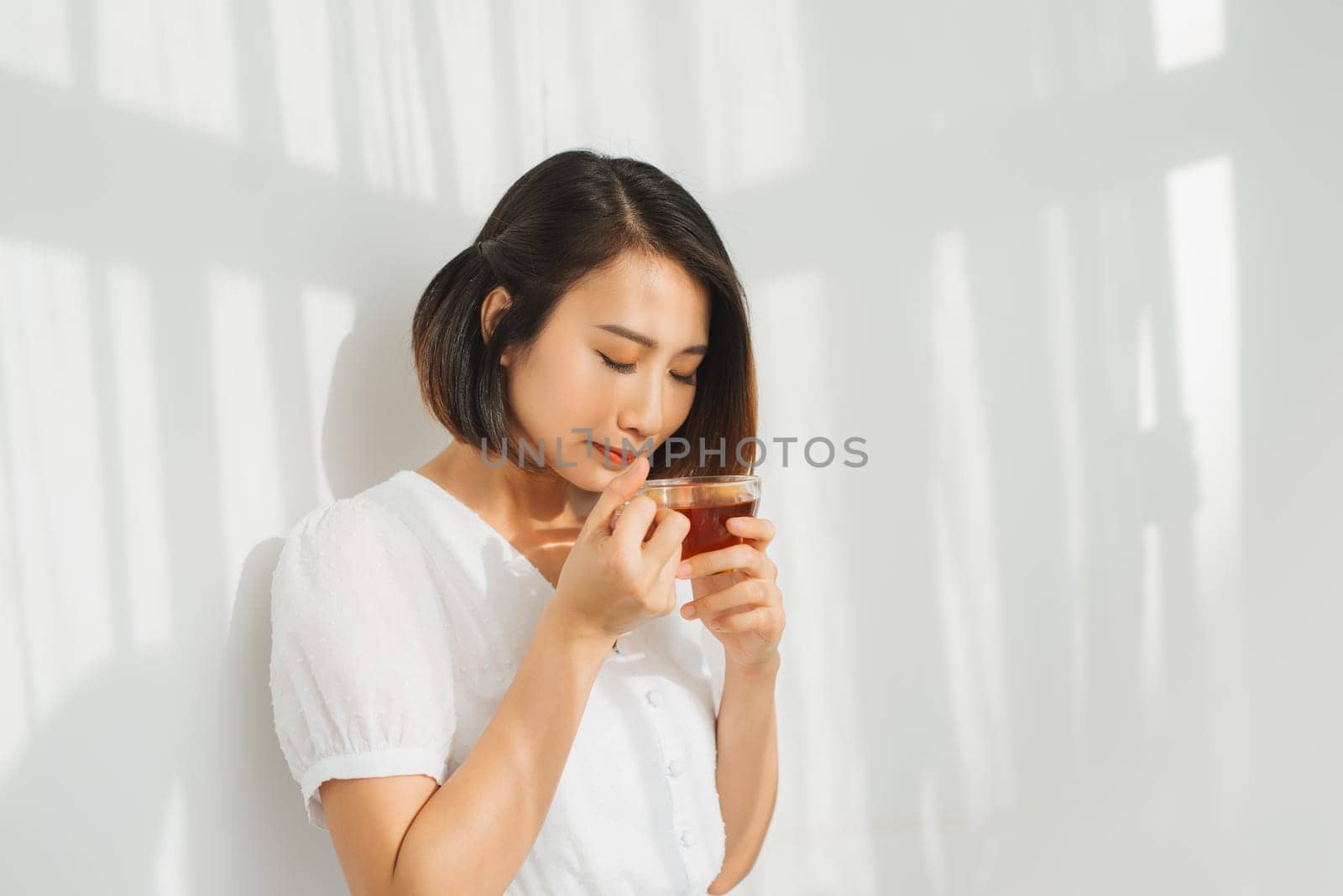 Young asian girl feeling happy with her cup
