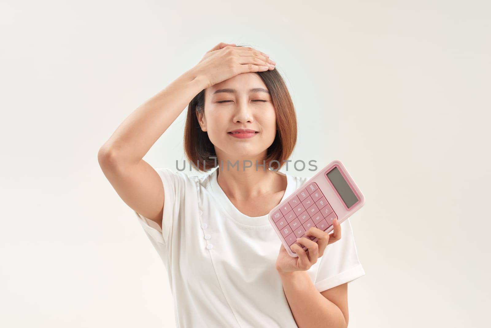 Feeling stress, unhappy, worry about the receipt or slip and the calculator in front for calculate payment or burden of over shopping by makidotvn