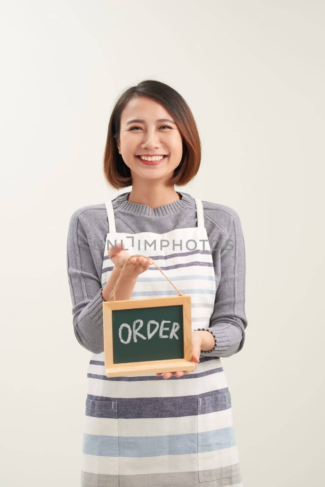 Waitress holding the chalkboard order sign on white background by makidotvn