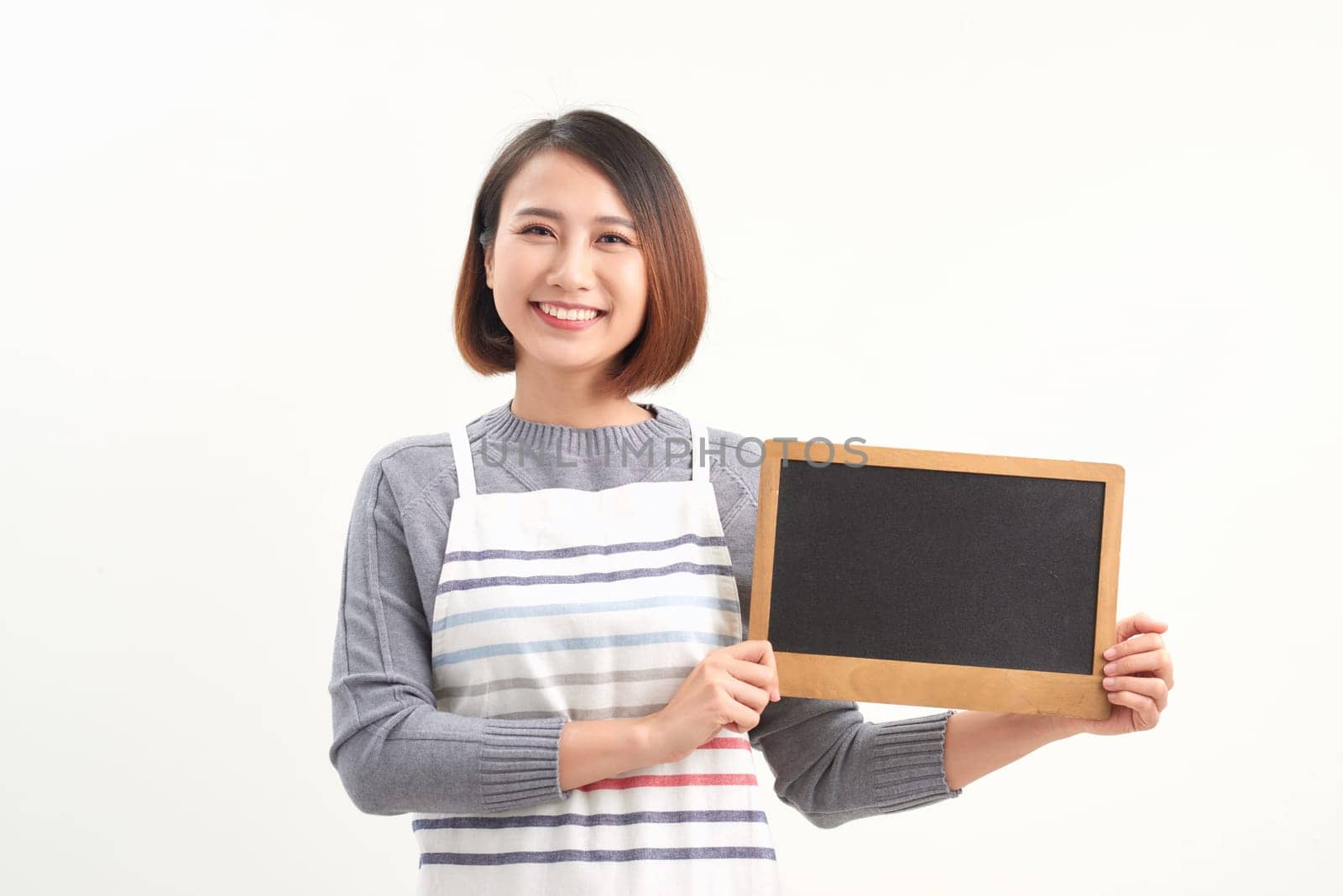 Asian woman wearing apron on white isolated background by makidotvn