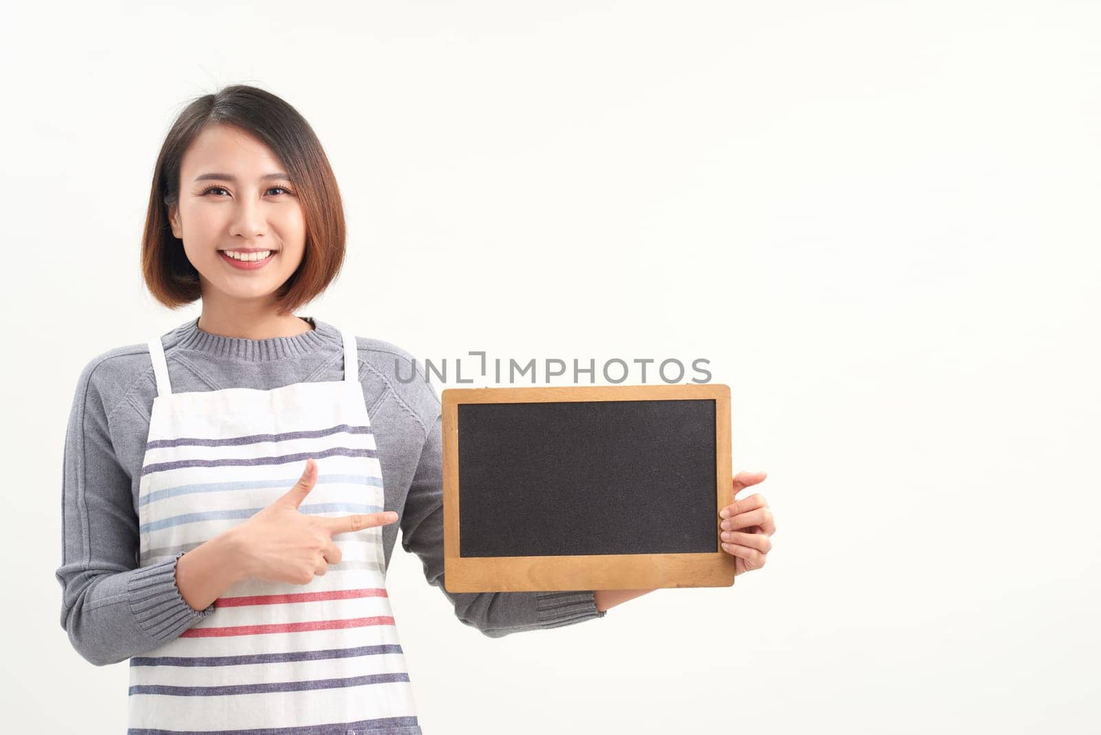 happy waitress holding blank chalkboard sign by makidotvn