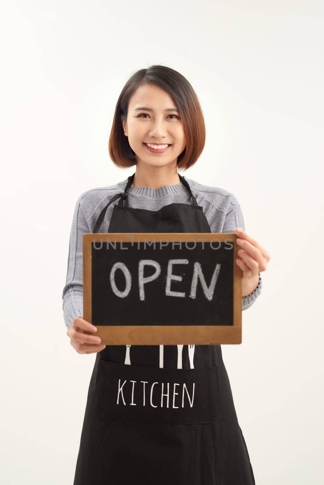 Portrait of young beautiful Asian cafe owner holding open sign by makidotvn