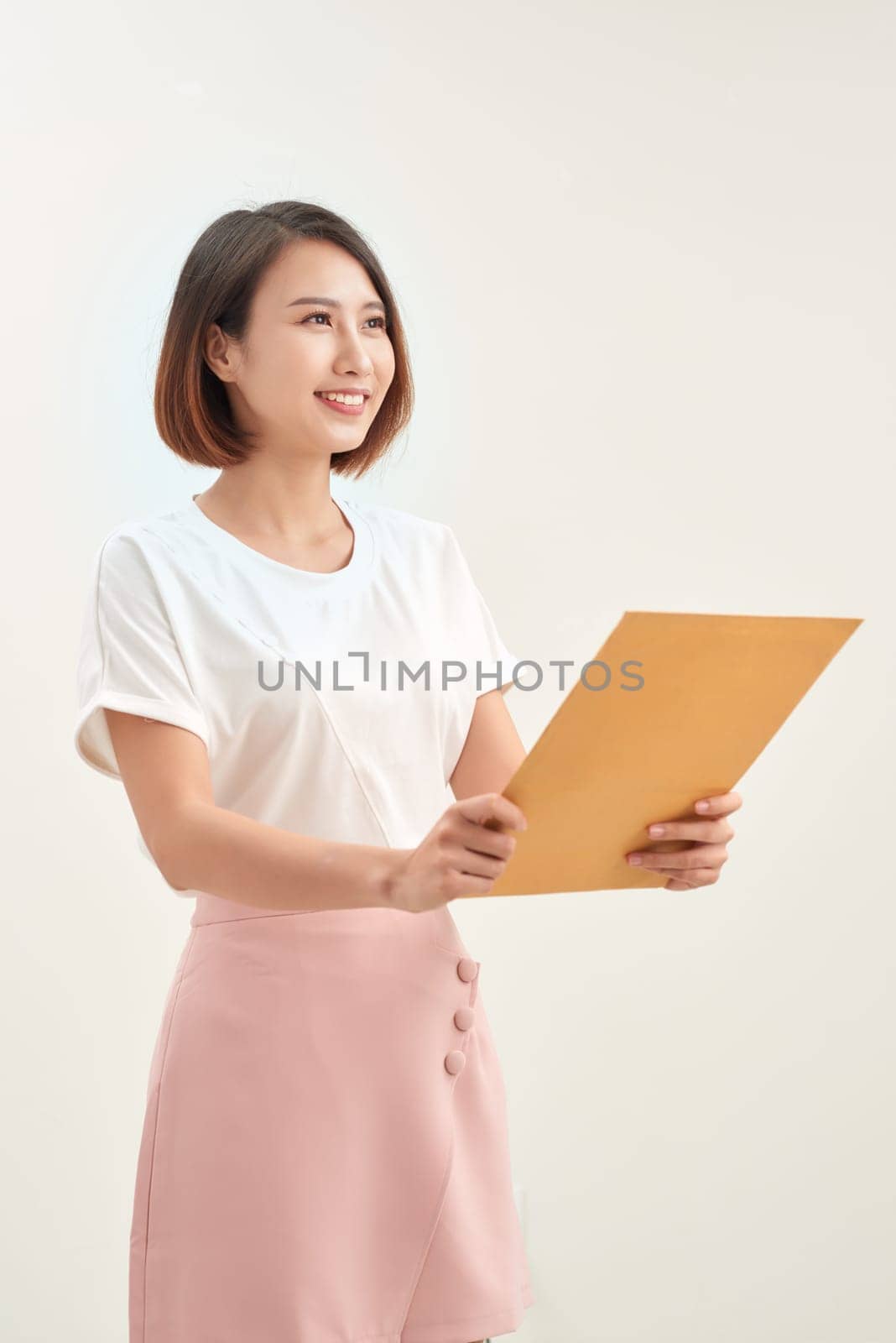 Young asian woman holding document envelopes for job application