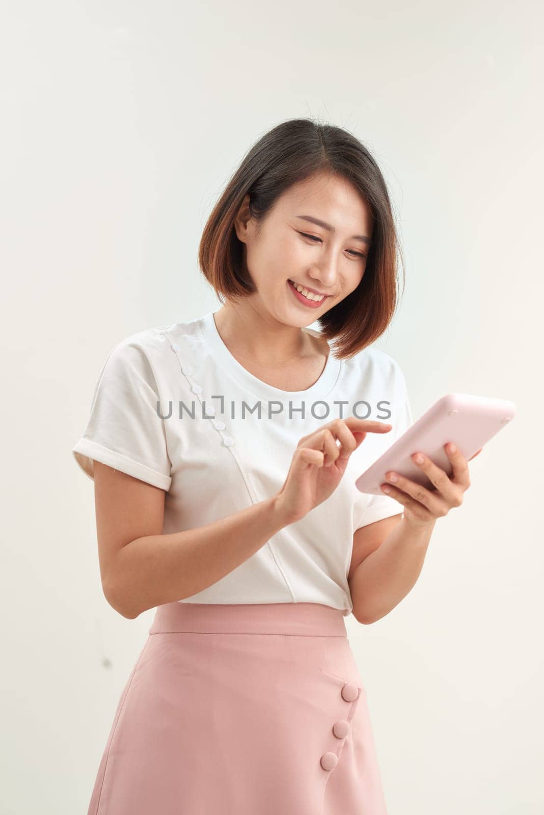 Happy smiling secretary holding calculator machine by makidotvn