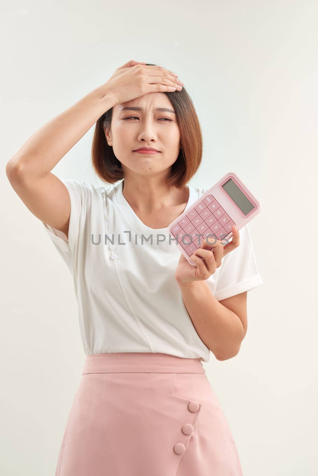 Feeling stress, unhappy, worry about the receipt or slip and the calculator in front for calculate payment or burden of over shopping by makidotvn