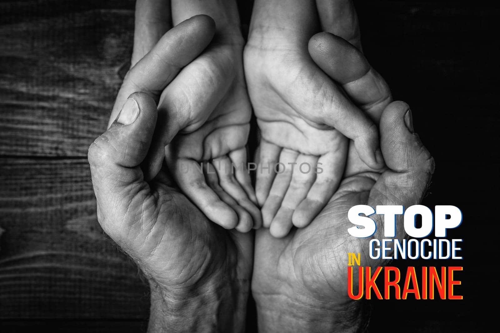 male hands hold childrens on a dark background with words stop genocide in ukraine. black and white color. concept needs help and support, truth will win