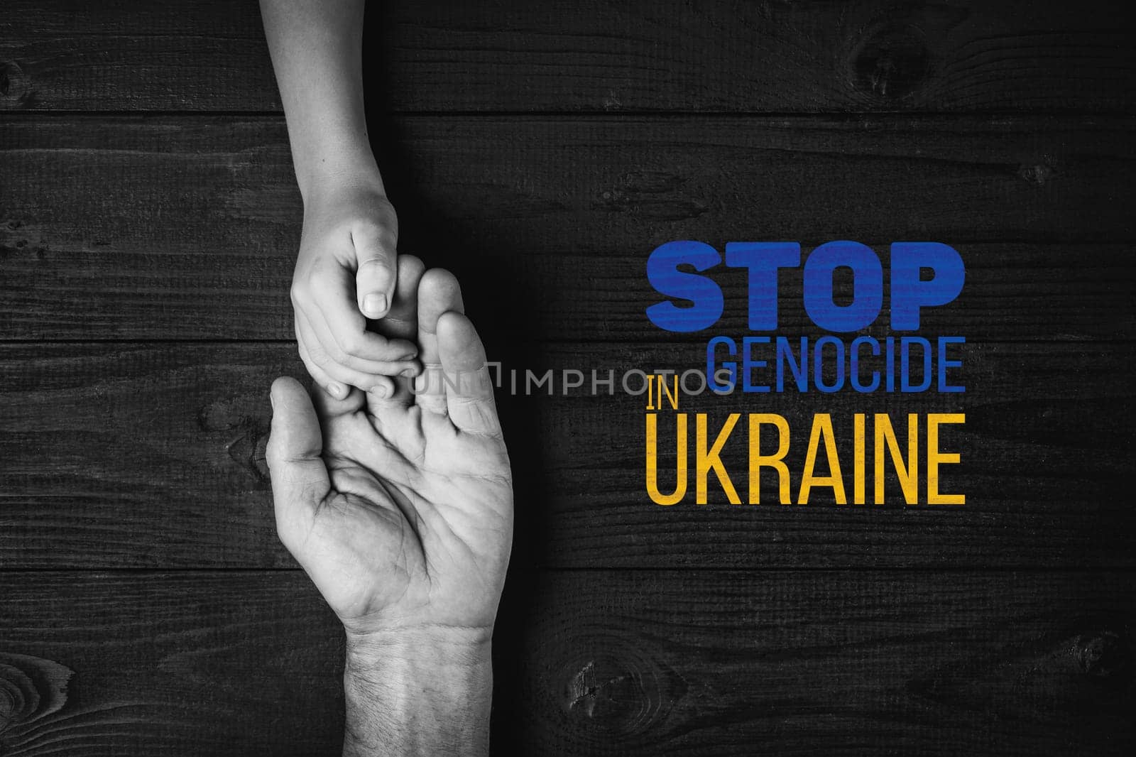 male hands hold childrens on a dark background with words stop genocide in ukraine black and white color. concept needs help and support, truth will win