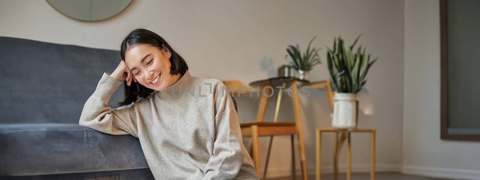 Vertical shot of beautiful asian woman, student sitting at home and studying remotely, elearning with laptop.