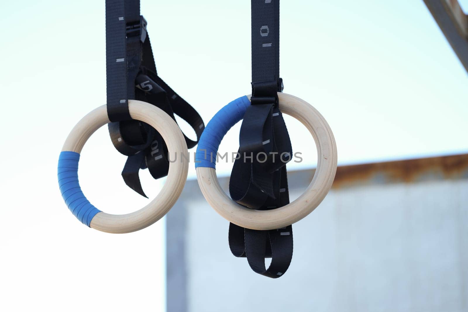 Sturdy wooden gymnastics rings designed for strength training, ideal for workouts and fitness enthusiasts alike