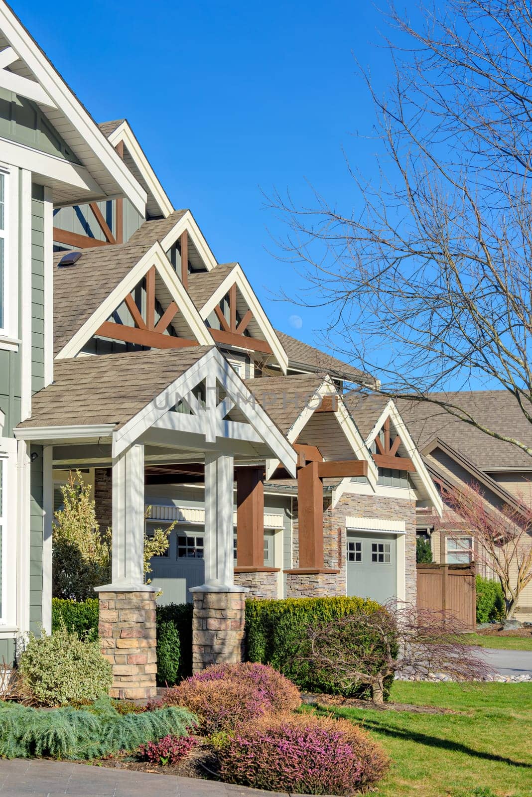 Front side of residential house on blue sky background.