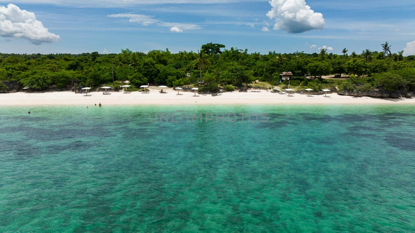 Top view of tropical sandy beach and blue sea. Bantayan island, Philippines.