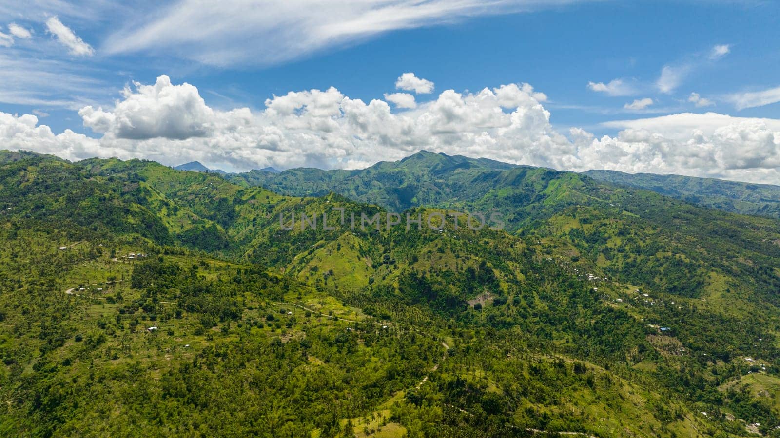 Aerial drone of mountain range with green tropical vegetation. Negros, Philippines