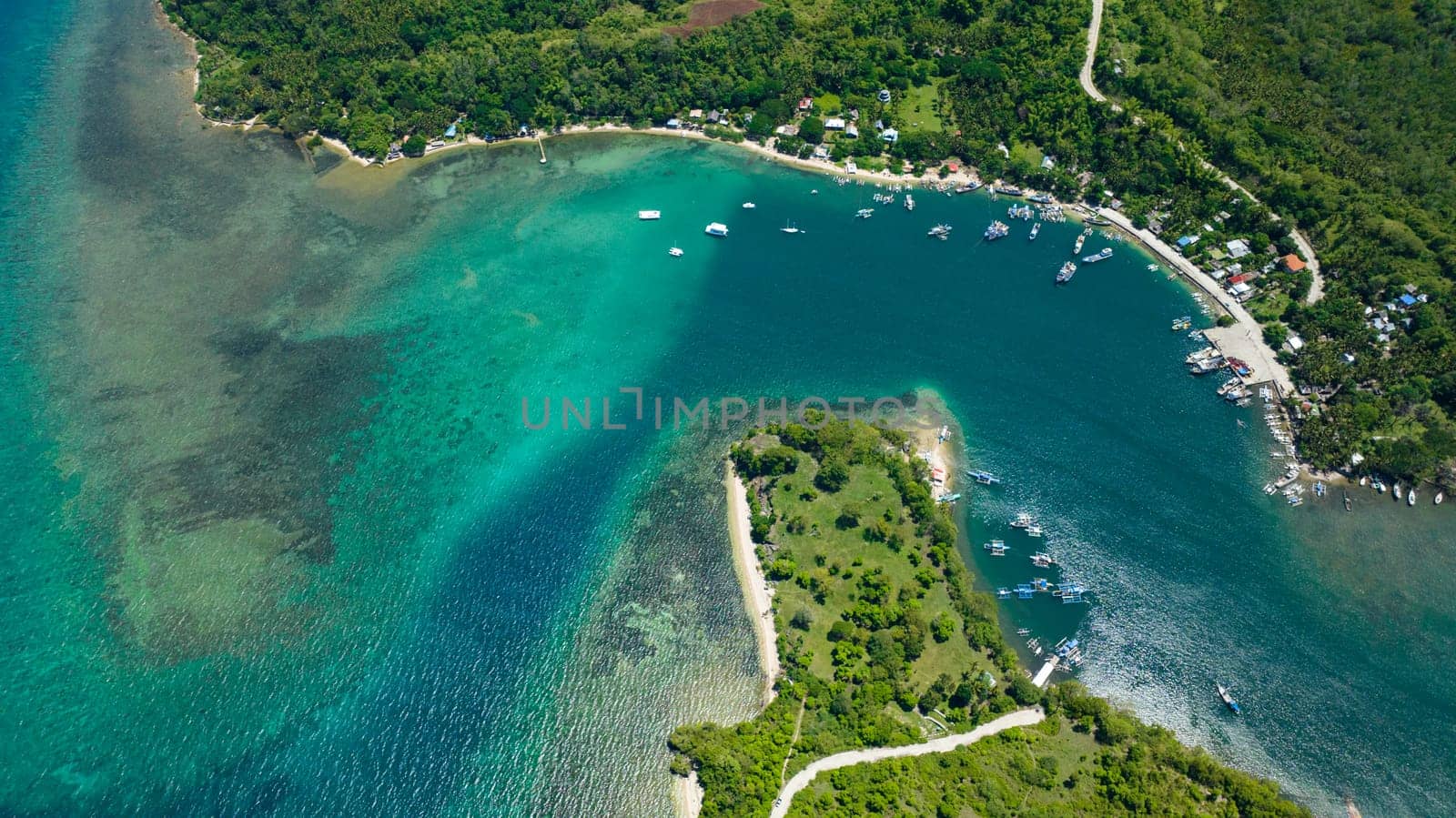 Top view of bay with moored boats and yachts. Negros, Philippines.