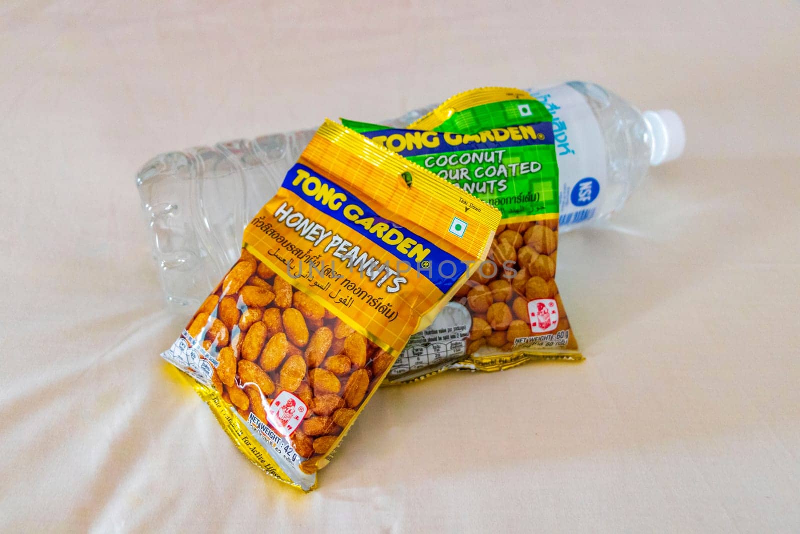 Thai snack snacks packs and water bottle in Naithon Beach Sakhu Thalang on Phuket island Thailand in Southeastasia Asia.