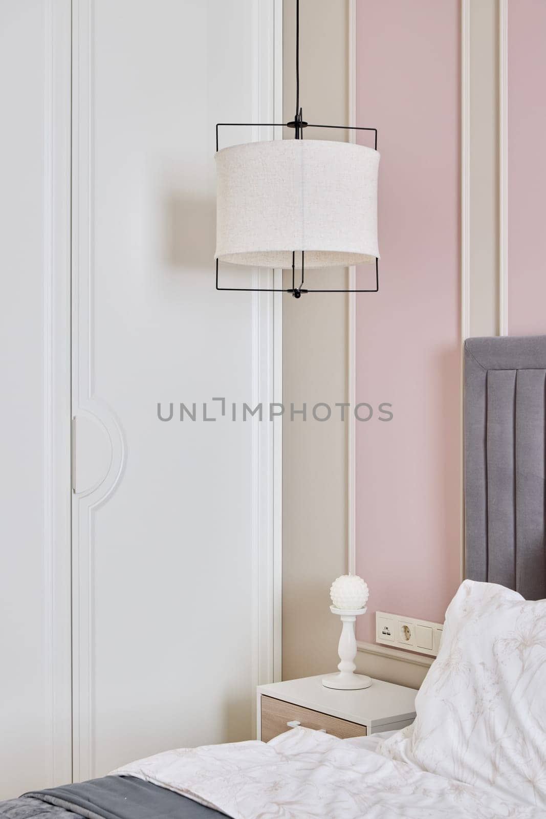 A stylish and aesthetically pleasing bedroom that showcases modern decor, soft lighting, and soothing colors