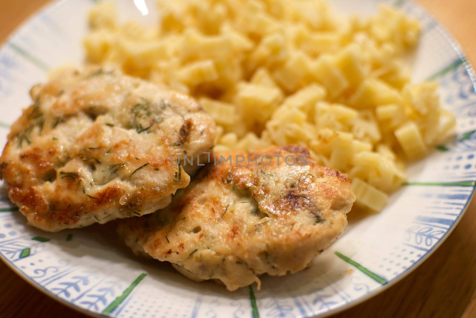 Indulge in delicious savory chicken patties served alongside creamy pasta, making for a hearty and satisfying meal