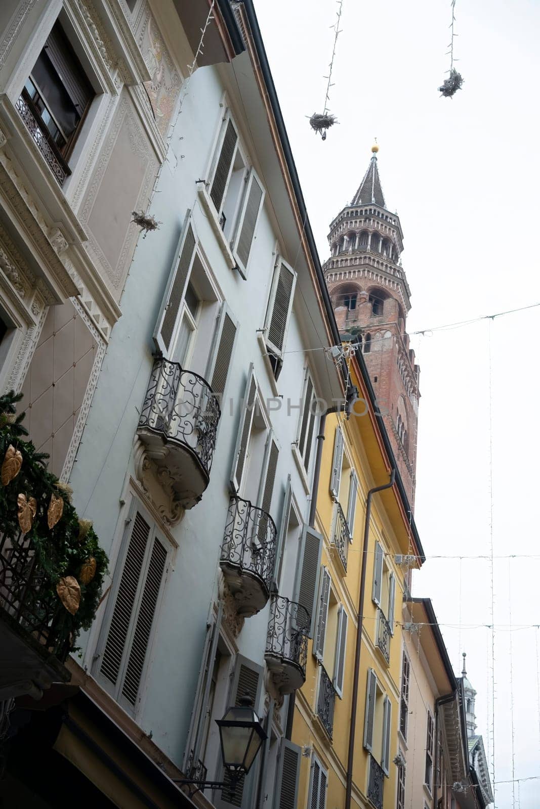 Cremona, Italy - November 20th 2024 The torrazzo of cremona. A historic bell tower. Rises majestically above the charming. Traditional buildings of cremona. Italy