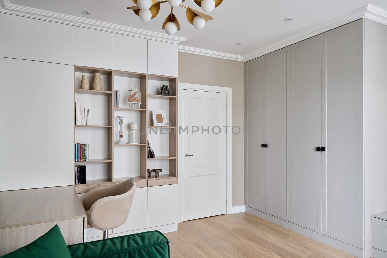 Modern living room design features sleek storage, elegant decor, and warm lighting for a cozy atmosphere