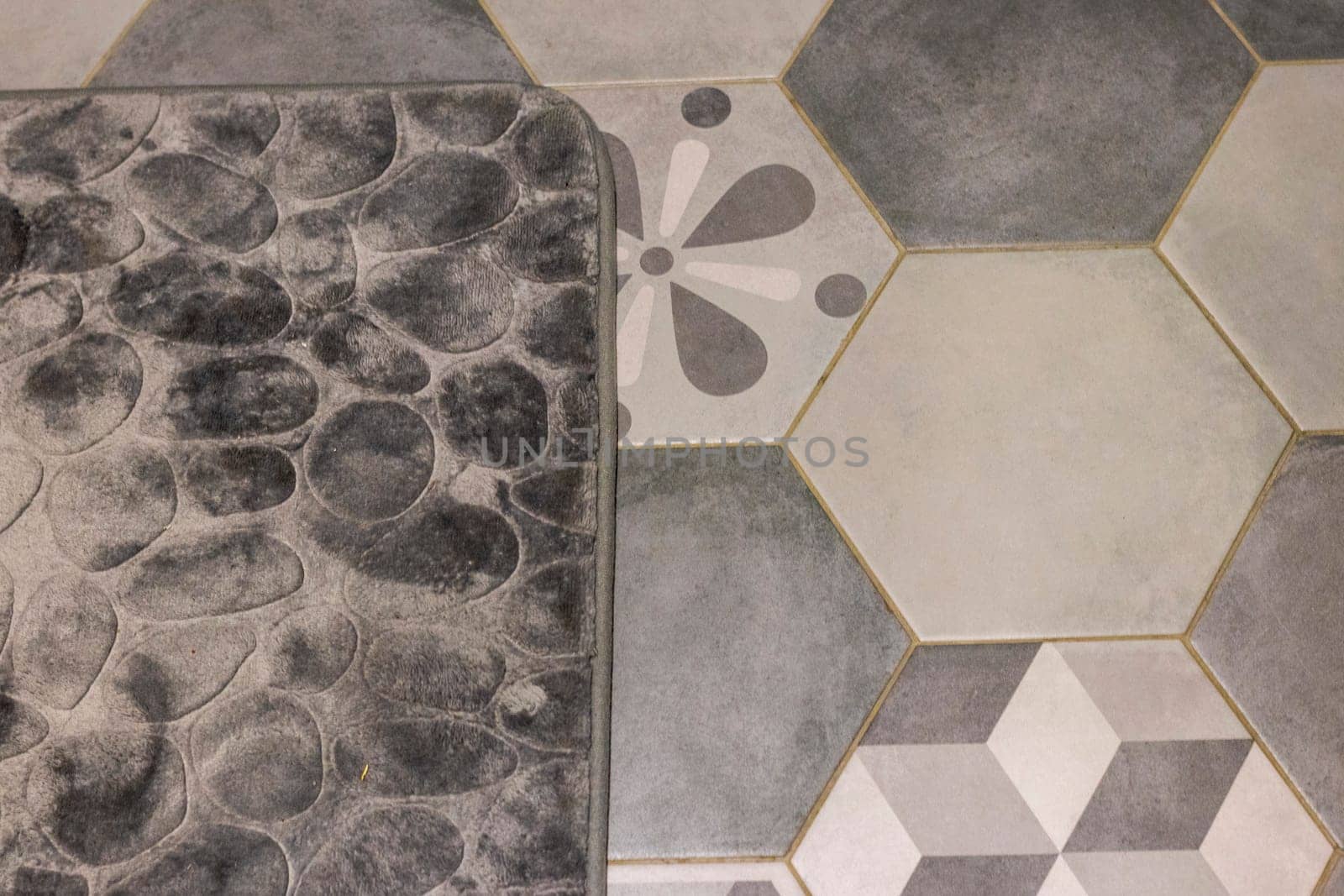 Shot of the mat on the tile floor of the bathroom