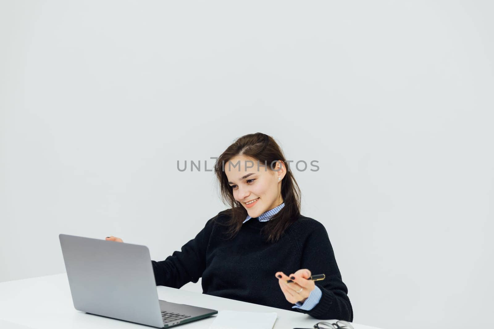 woman learning online laptop in office at desk