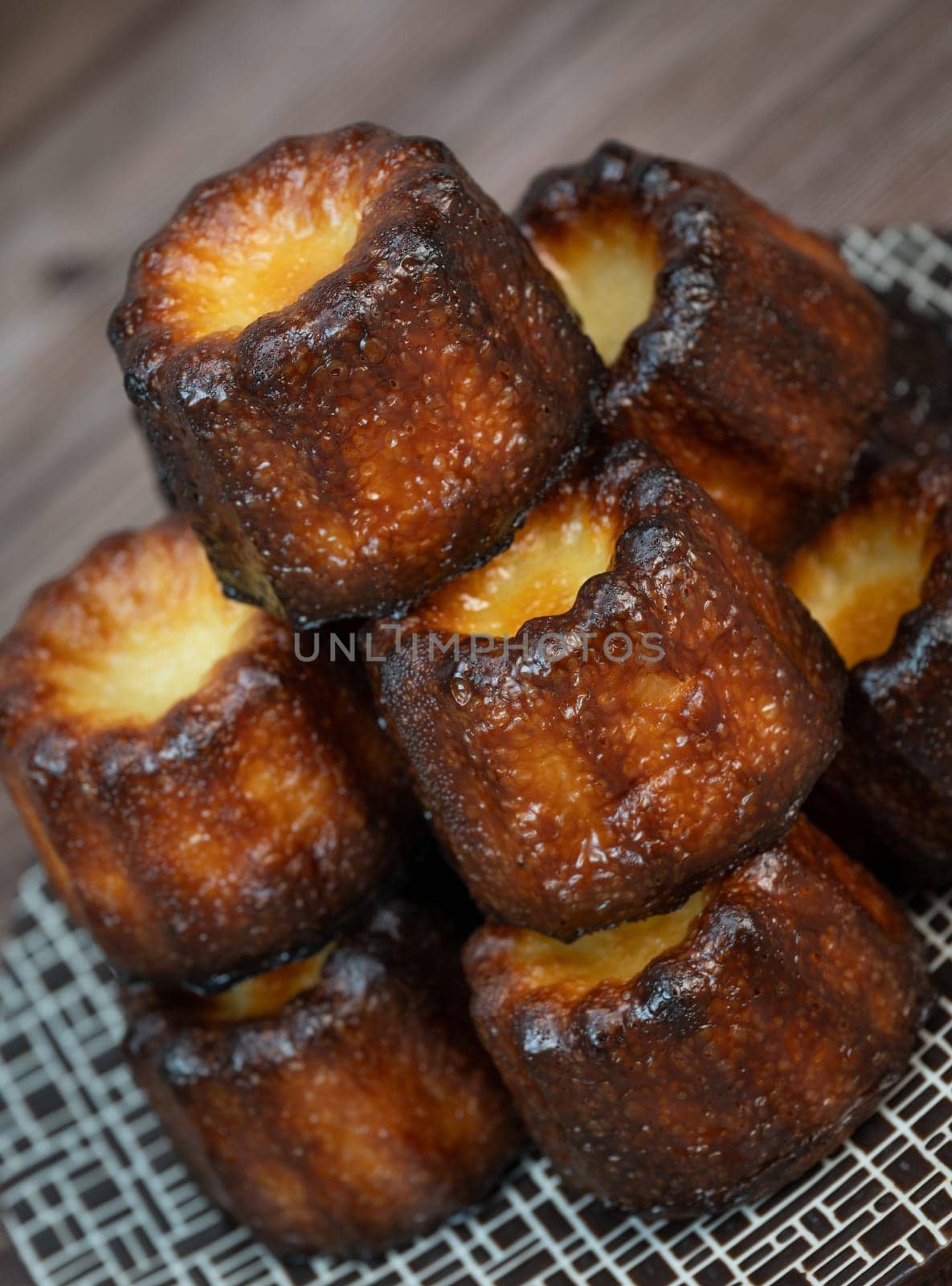 Caneles de bordeaux, traditional French sweet dessert with white table background, High quality photo