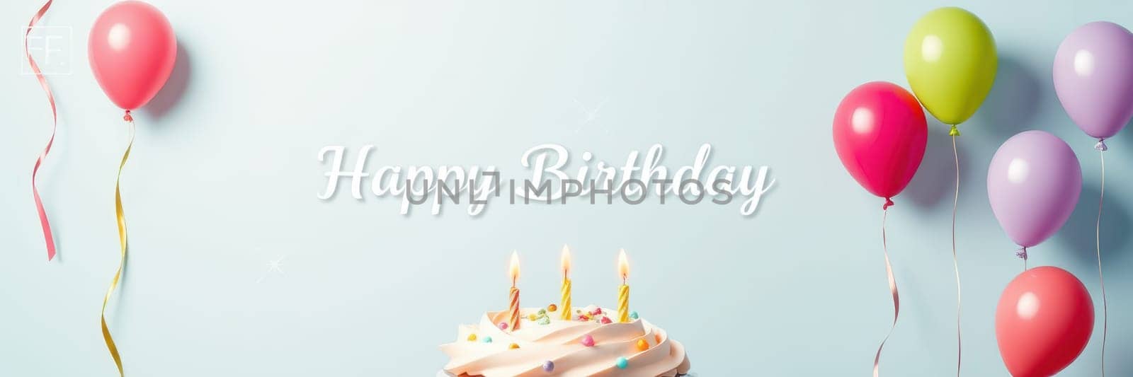 A festive setting features a cake adorned with candles, surrounded by colorful balloons in various shades, creating a joyful atmosphere for a birthday celebration.