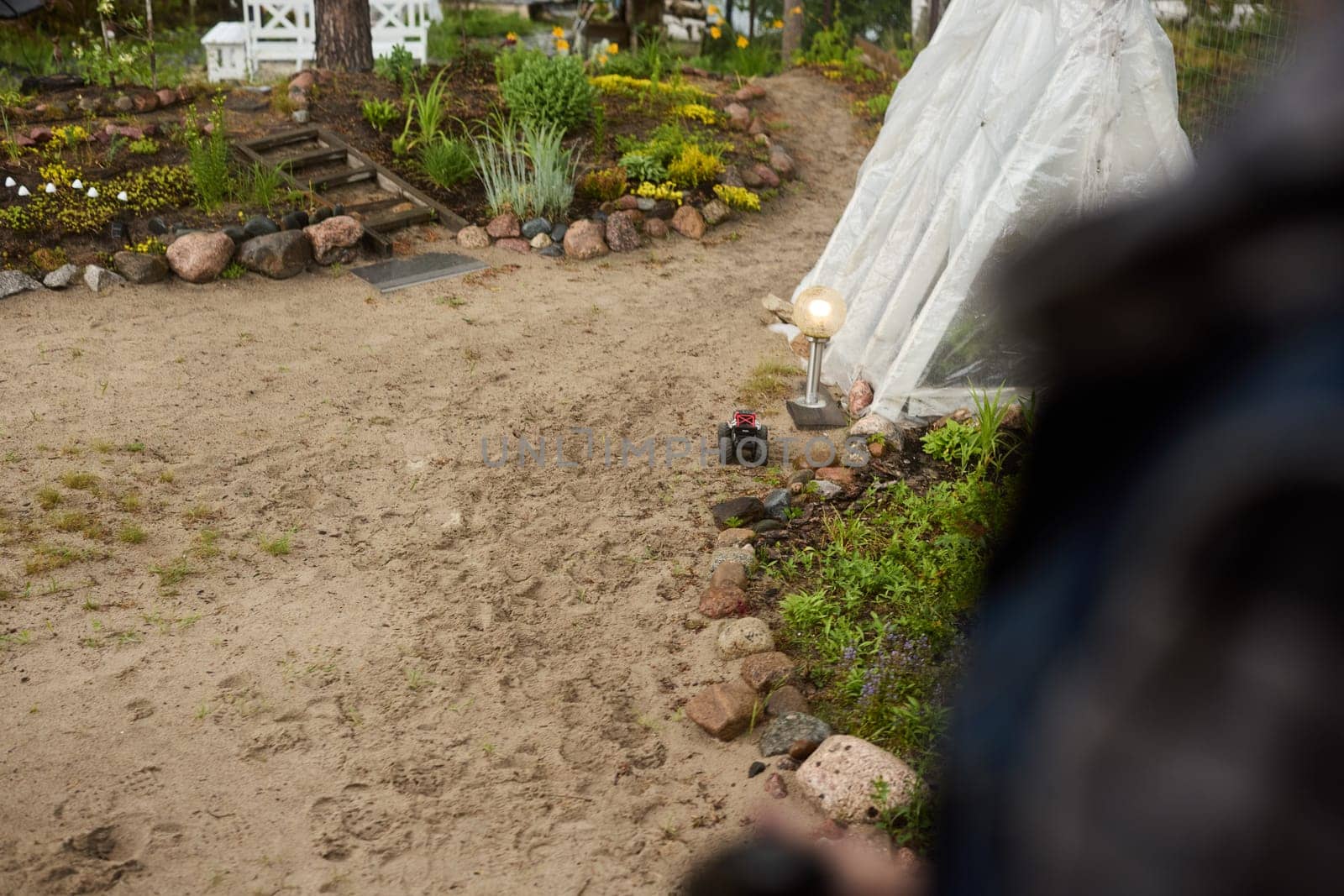 A peaceful and beautiful garden pathway, framed by colorful flowers and a lovely statue that invites deep tranquility