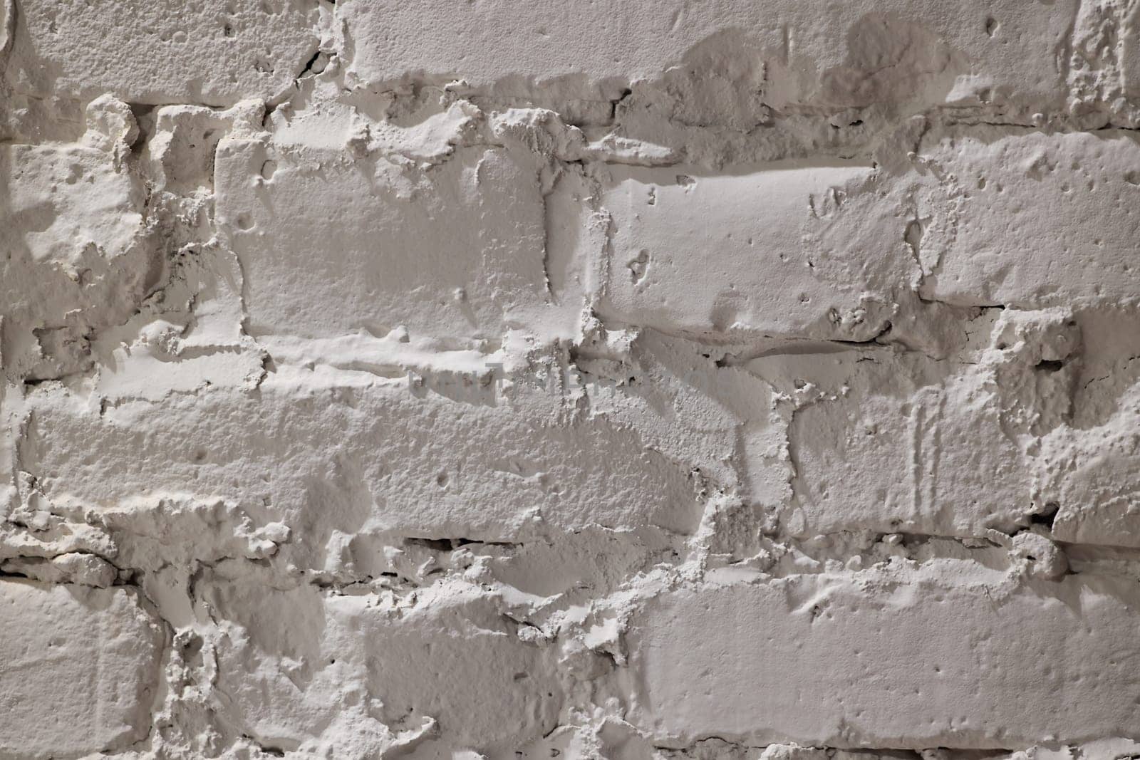 A closeup view of a stylish and textured white brick wall, perfect for various backgrounds or design projects