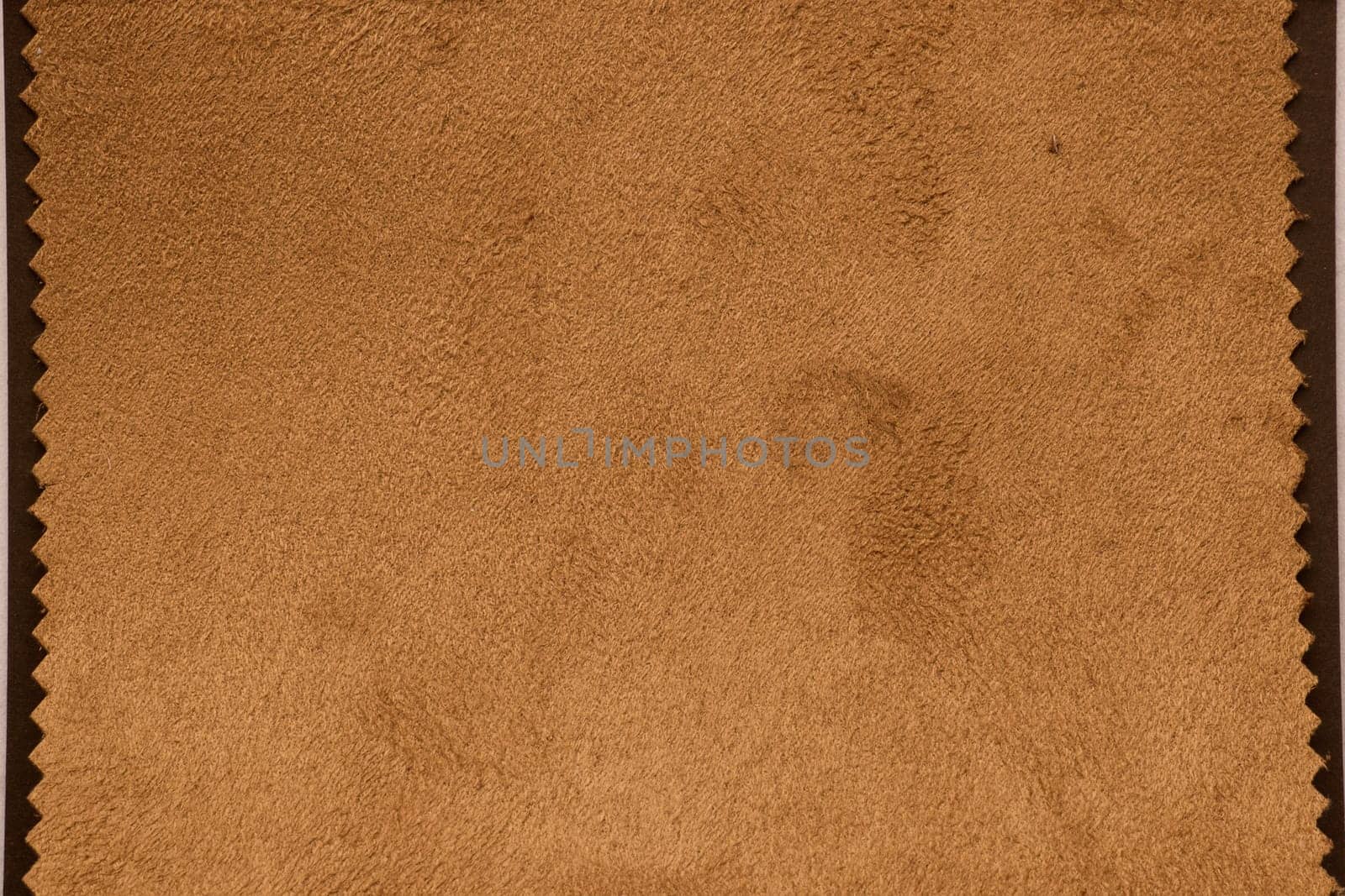 This soft, luxurious brown suede fabric is ideal for upholstery projects and fashion design applications