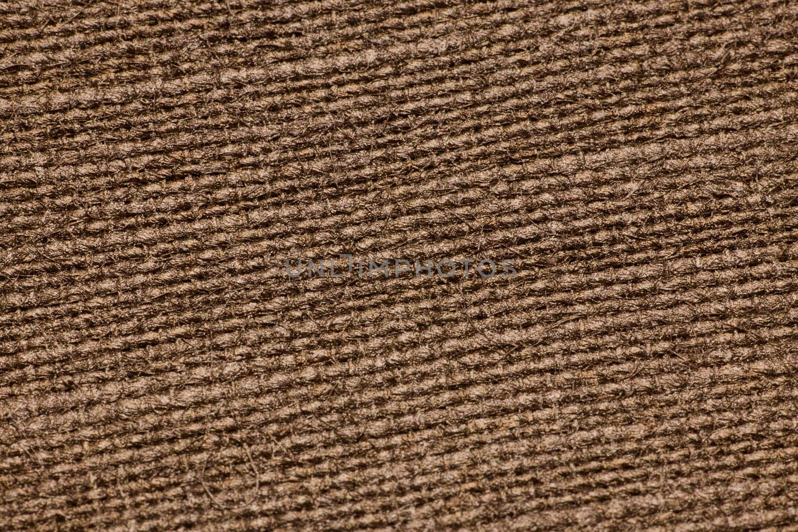 This is a detailed closeup showing a textured brown fabric, which is ideal for various design and media projects