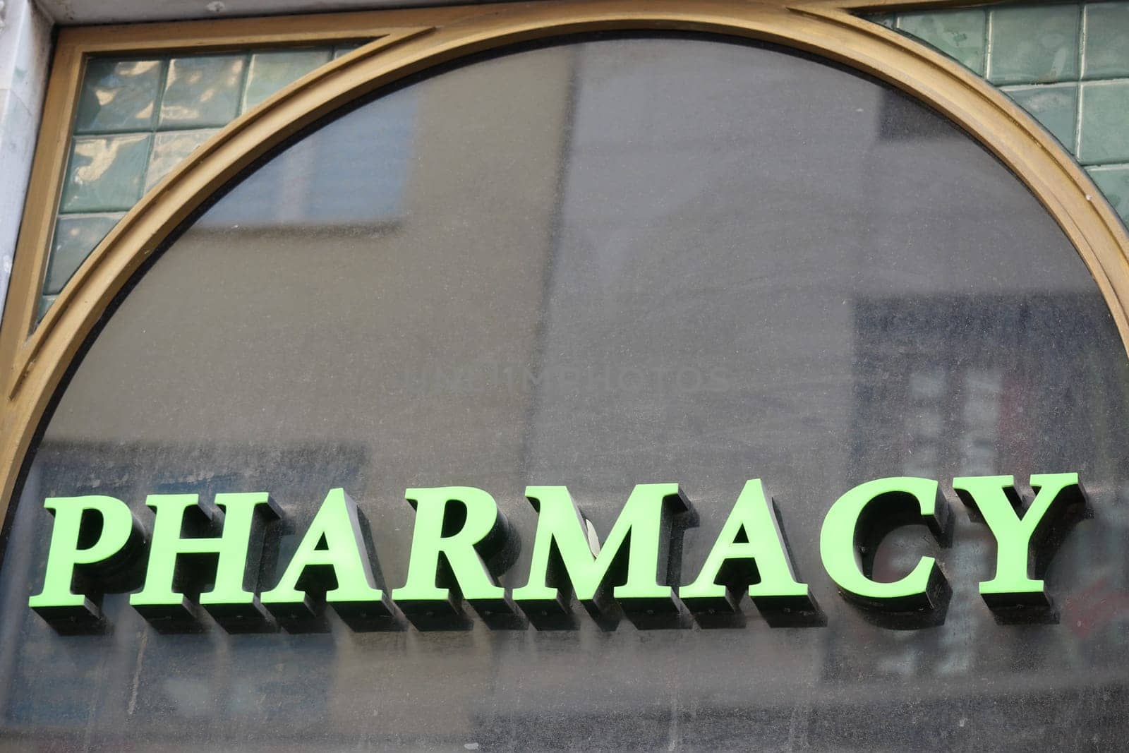visible pharmacy sign on a building ,