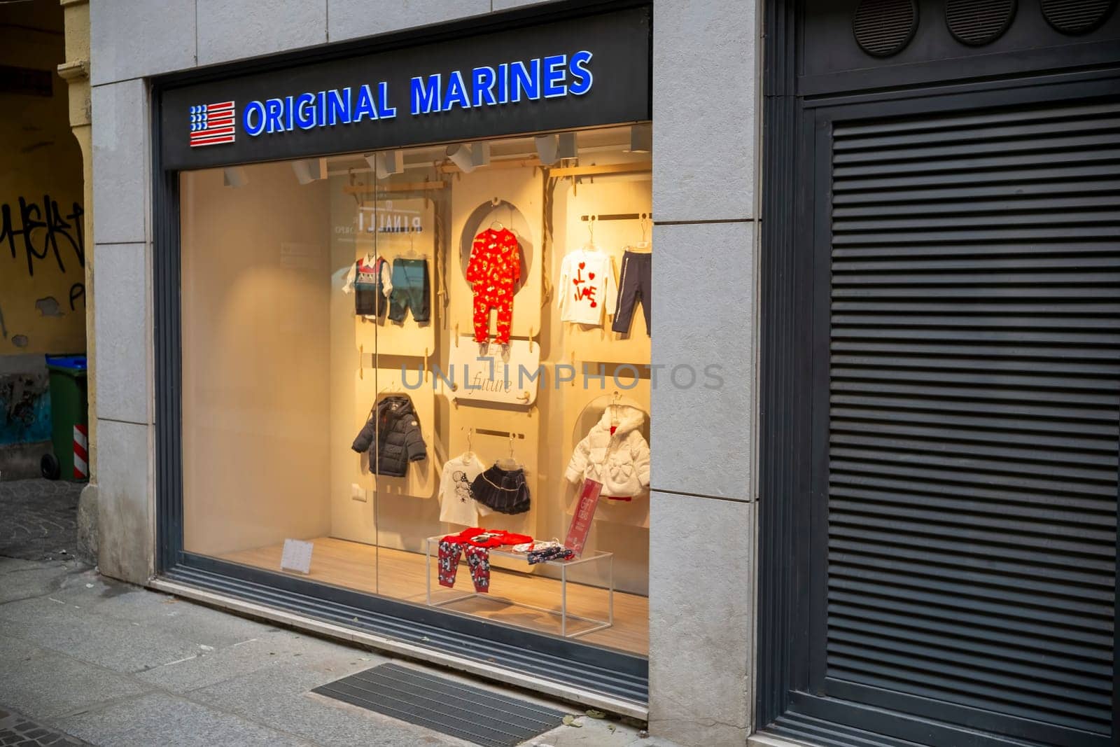 Cremona, Italy - November 20th 2024 A brightly lit original marines store showcases a variety of children's clothing in cremona, italy, featuring warm winter outfits