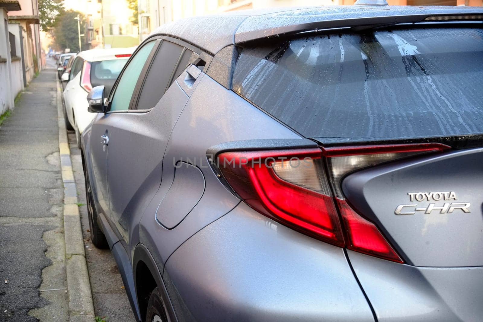 Cremona, Itally - October 6th 2024 Sleek lines and a distinctive rear define the parked toyota c-hr hybrid, highlighting its contemporary style and eco-conscious engineering