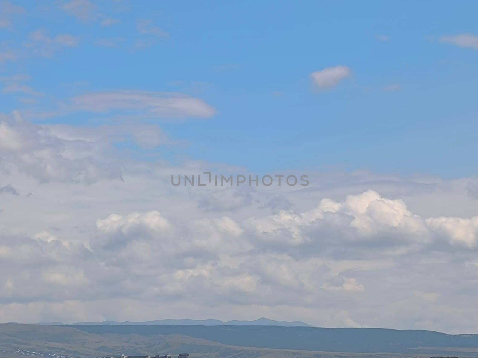 blue gray beautiful sky, white clouds, background weather nature air atmosphere. Landscape High quality photo