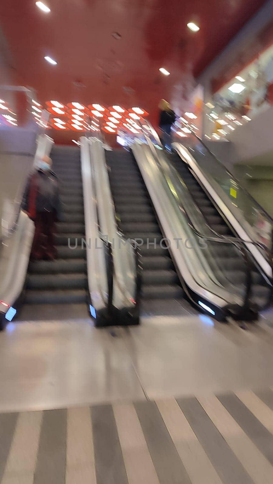 October 23 2024, Prague Czech Republic Europe, escalator at the city railway station, transport, traffic, industry, red color ceiling with lamps. High quality photo