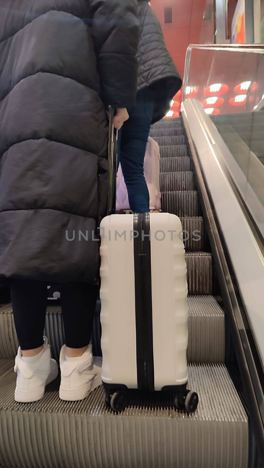 October 23 2024, Prague Czech Republic Europe, escalator at the city railway station, transport, traffic, industry, red color ceiling with lamps. High quality photo
