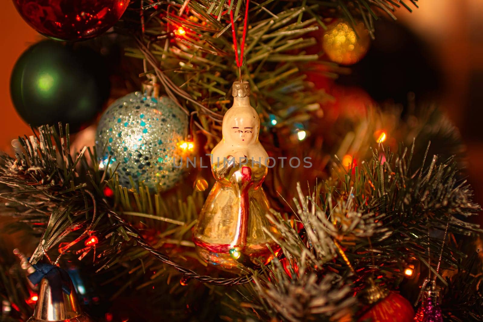 Beautiful festive decorations on the Christmas tree. Close-up. Beautiful Christmas background. The concept of decorations and decor for the new year. New Year's Card 2025. High quality photo