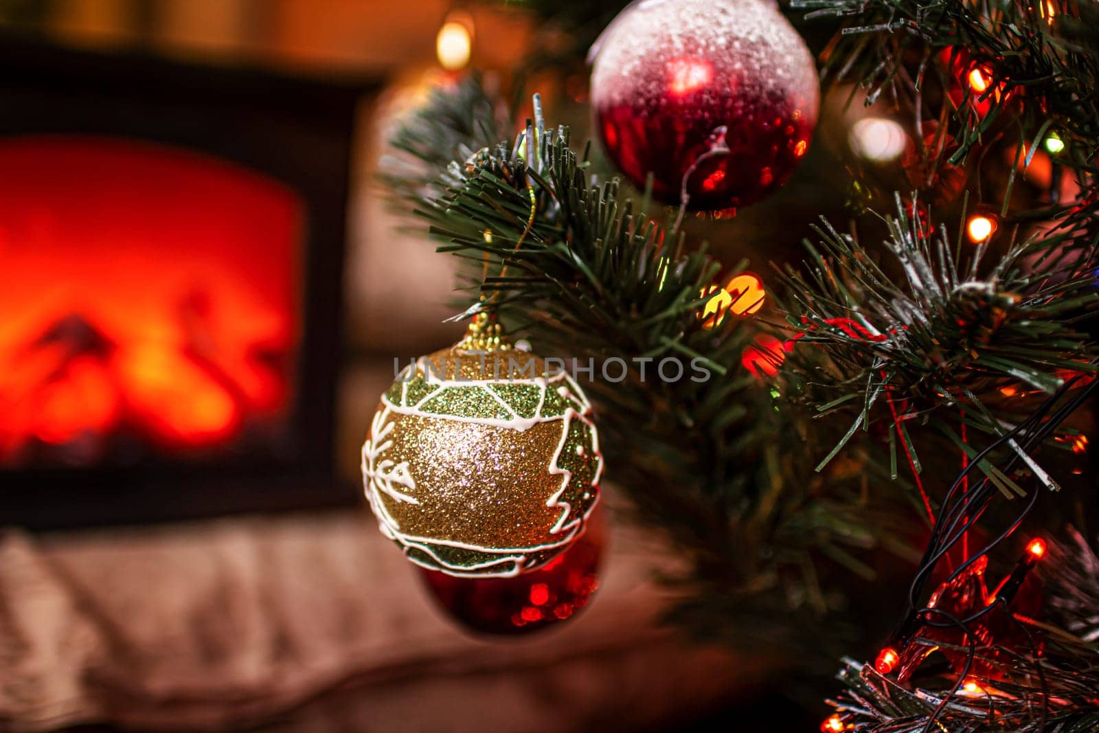 Beautiful festive decorations on the Christmas tree. Close-up. Beautiful Christmas background. The concept of decorations and decor for the new year. New Year's Card 2025. High quality photo