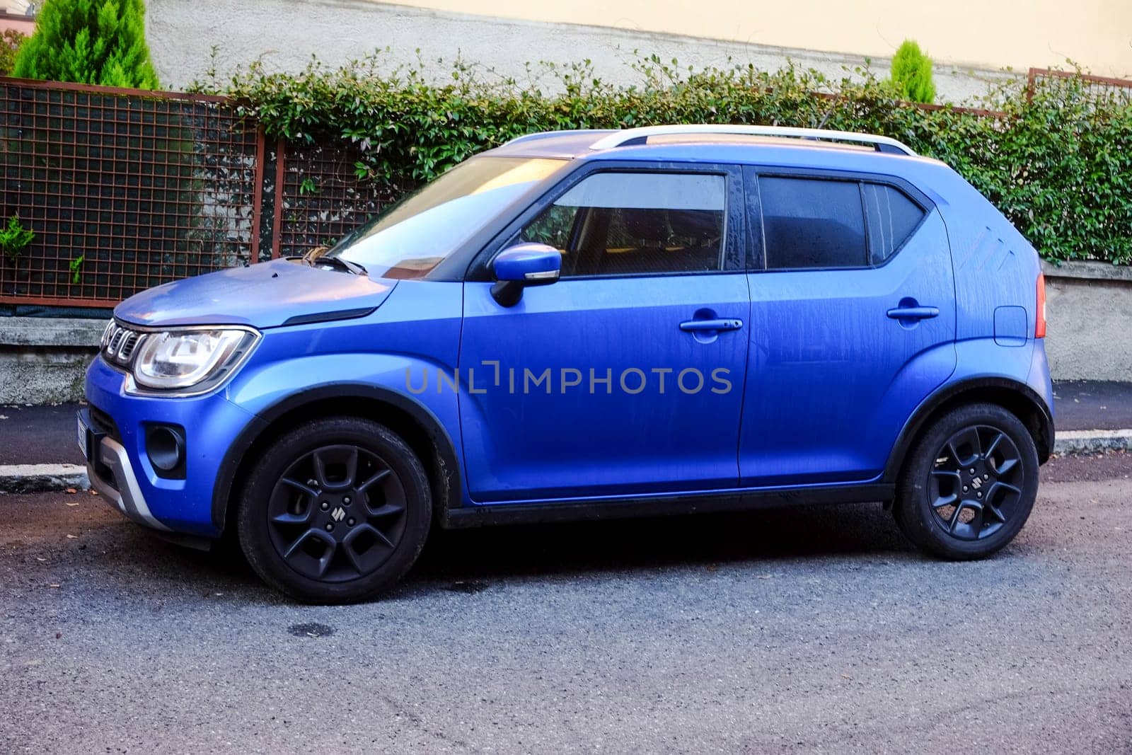 Cremona, Itally - October 6th 2024 Parked blue suzuki ignis 1.2 dualjet hybrid allgrip, a compact suv perfect for city driving and light off-road adventures