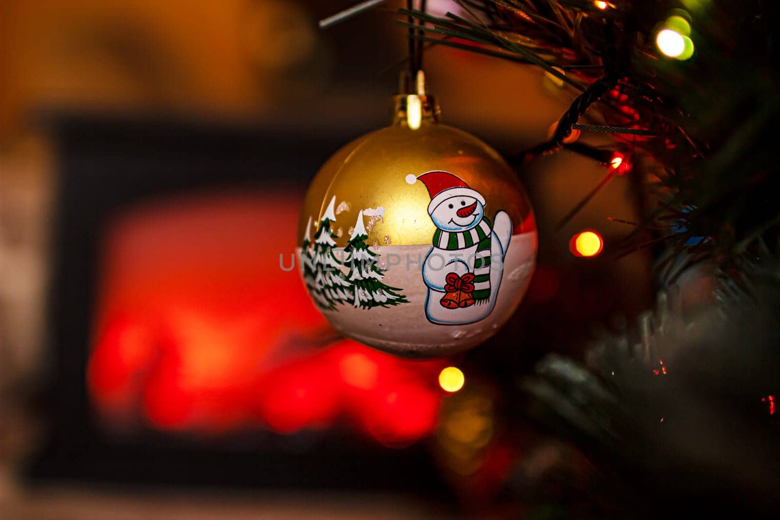 Beautiful festive decorations on the Christmas tree. Close-up. Beautiful Christmas background. The concept of decorations and decor for the new year. New Year's Card 2025. High quality photo