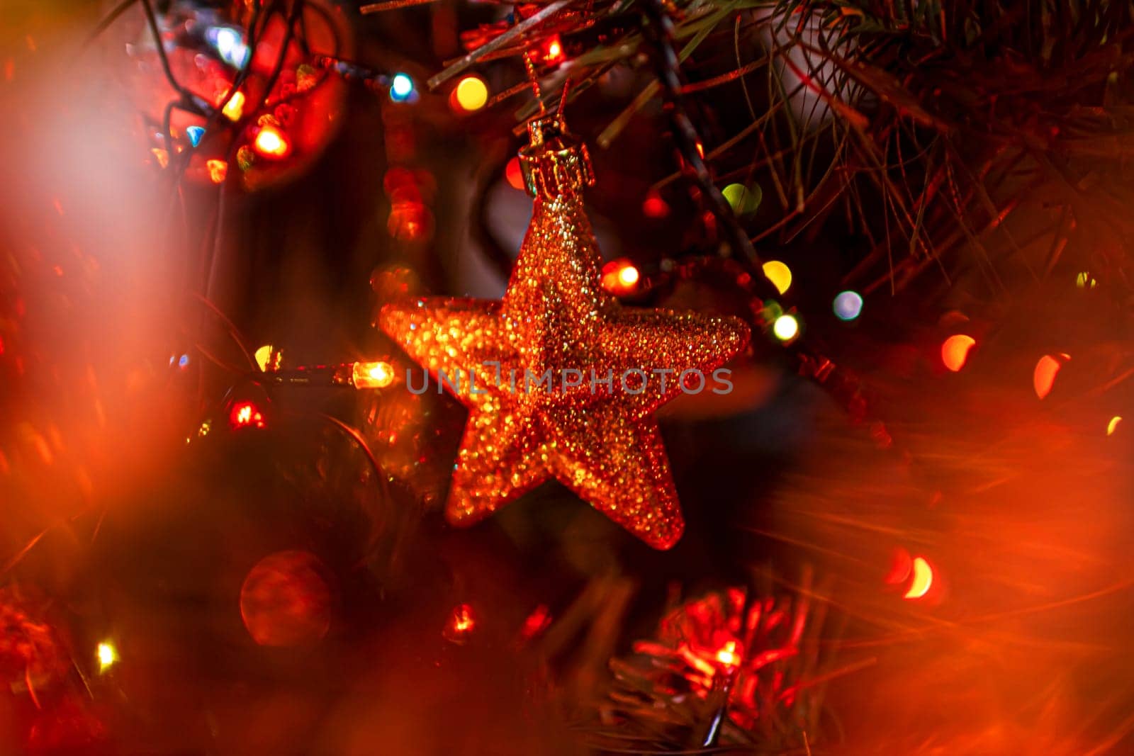 Beautiful festive decorations on the Christmas tree. Close-up. Beautiful Christmas background. The concept of decorations and decor for the new year. New Year's Card 2025. High quality photo