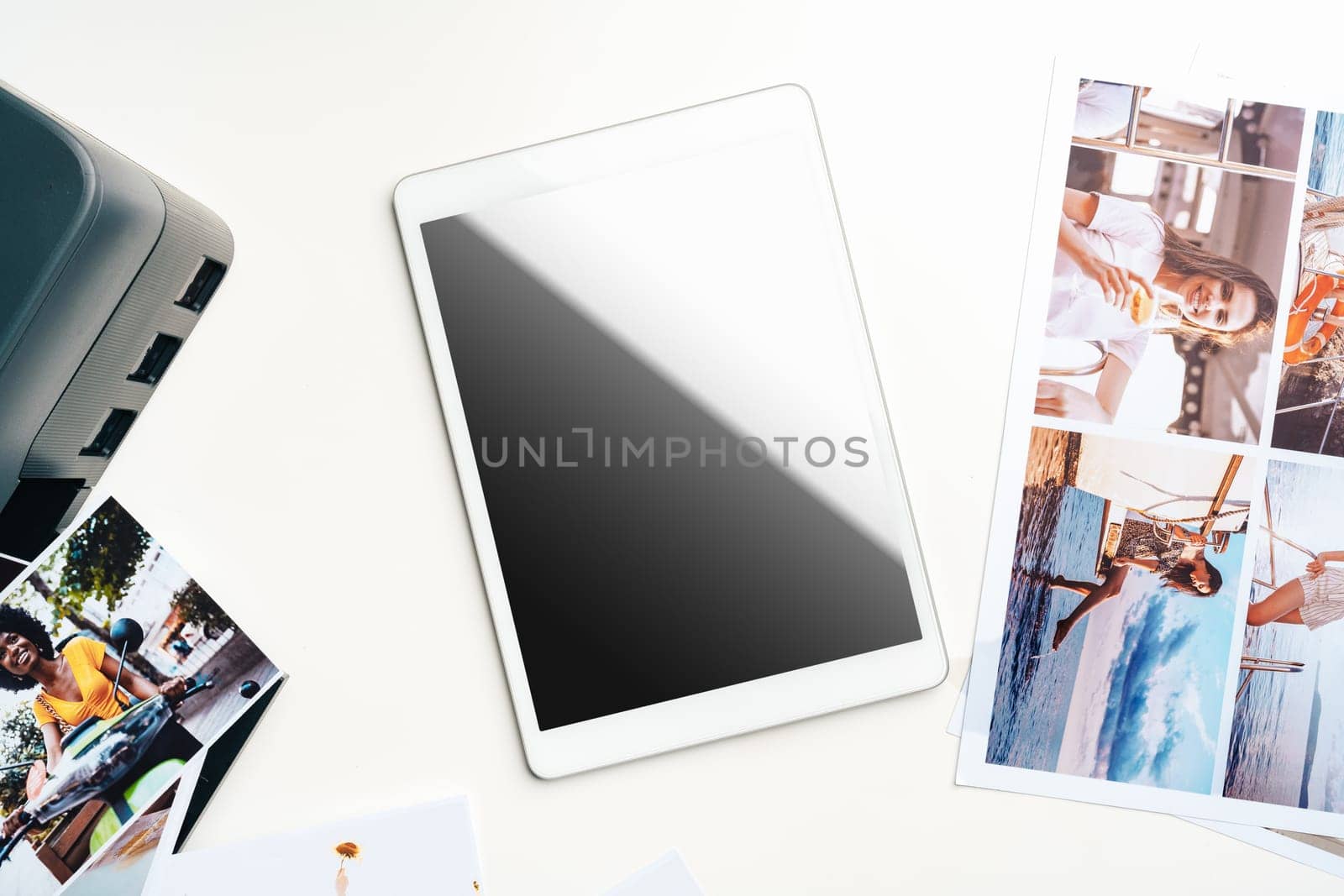 Printer and digital tablet on the table. Printing photos concept