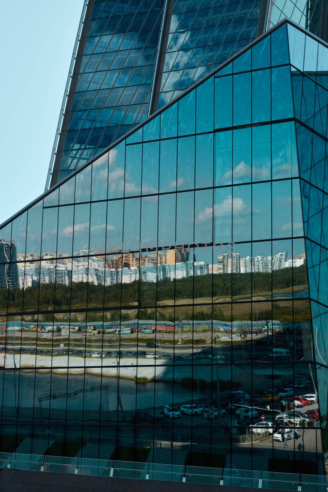 An intricate glass structure reflecting the surrounding urban landscape with stunning visual elegance and details