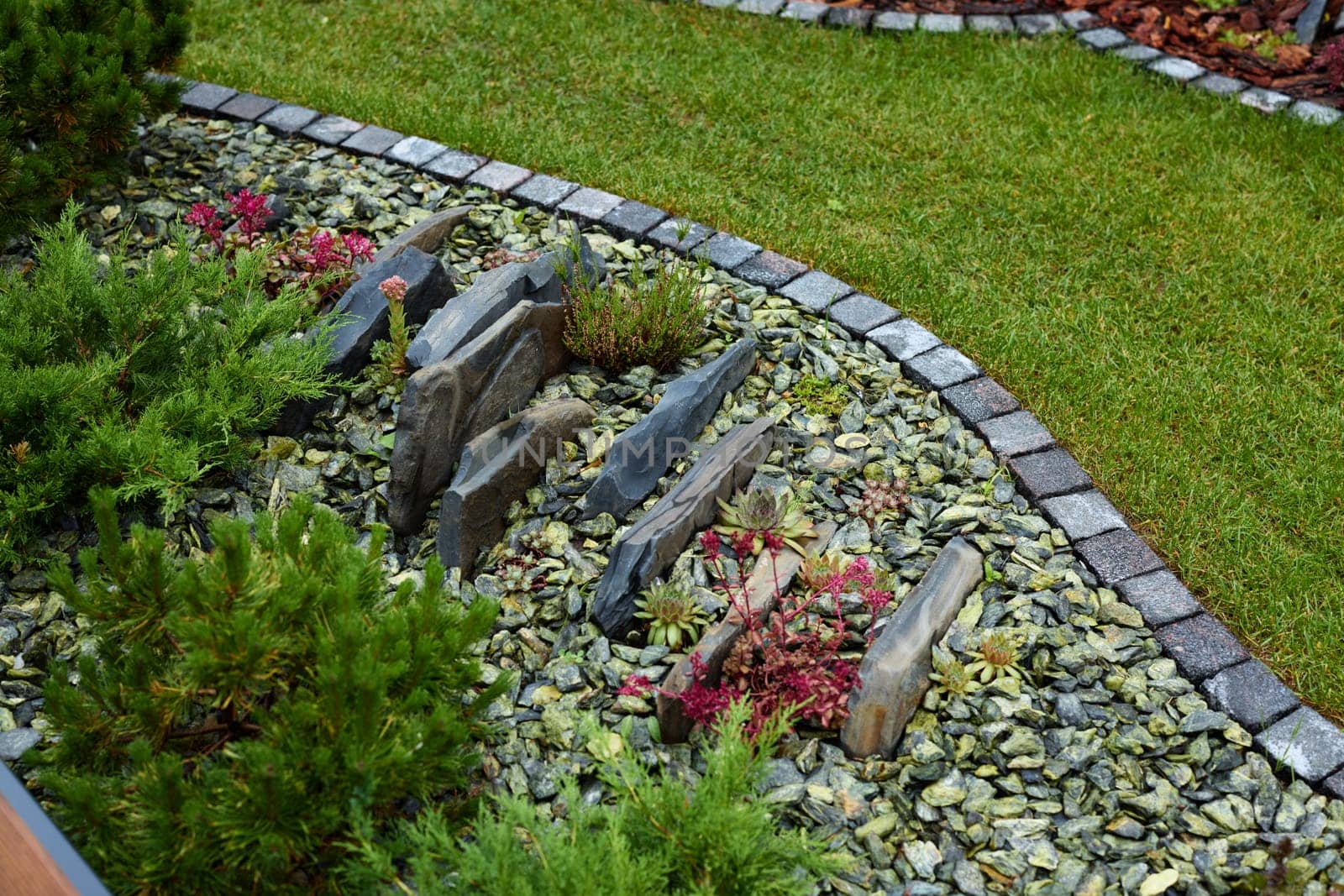 A tranquil and serene graveyard scene featuring stones and lush greenery, perfect for deep reflective moments