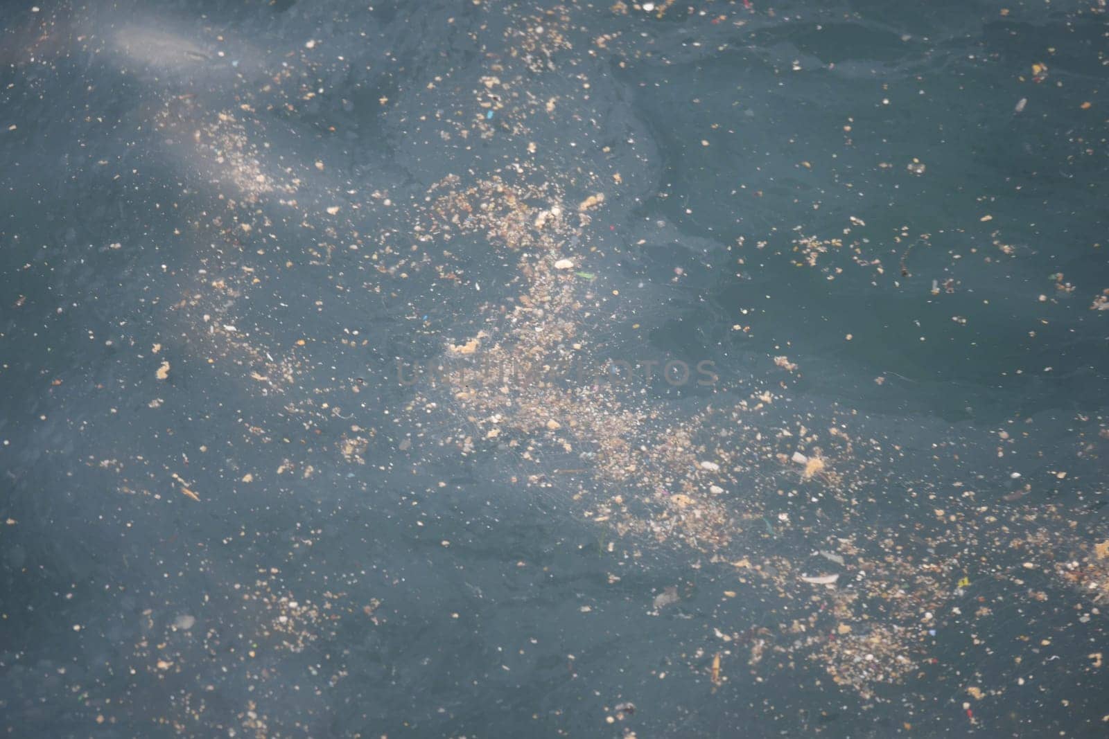 Sea water pollution with garbage.