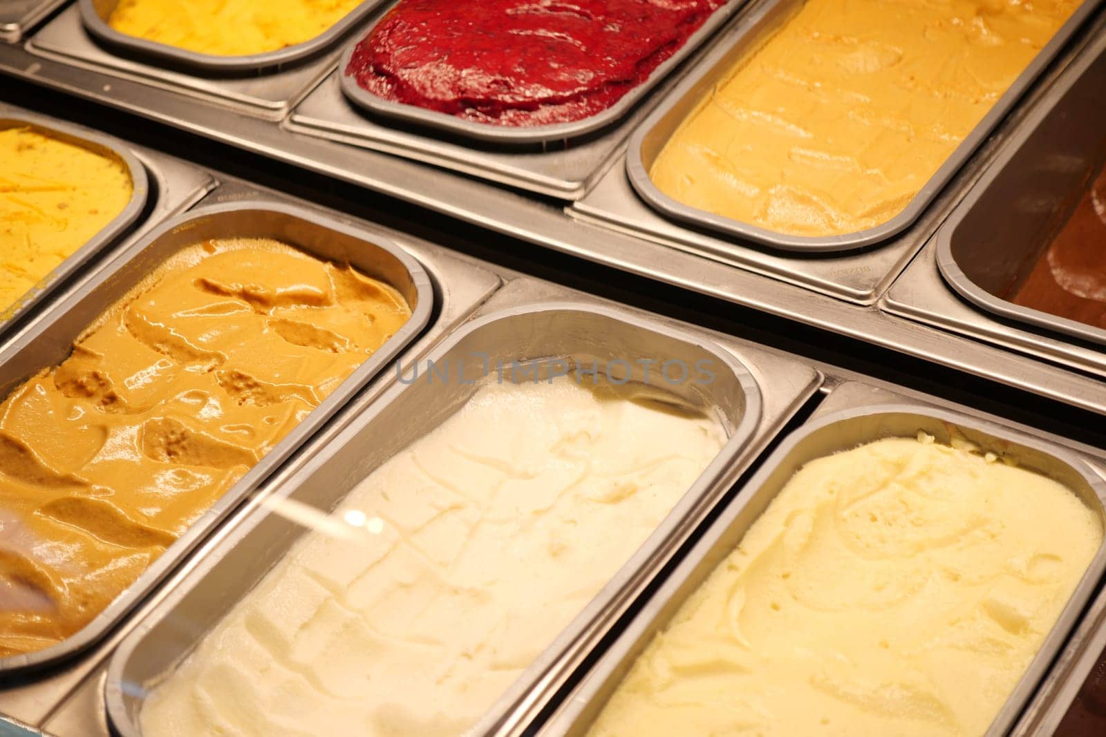 chocolate, vanila and orange favor of ice cream display for sale .